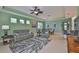 The living space features an open floor plan to the kitchen, dining area, and lots of natural light at 724 Chipper Dr, Sun City Center, FL 33573