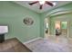 Open office space with archway and ceiling fan showcasing desk, decor, and bright walls creating a welcoming area at 724 Chipper Dr, Sun City Center, FL 33573