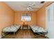 Bright bedroom features two twin beds, and a central table, great for or guests at 7317 W Pocahontas Ave, Tampa, FL 33634