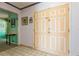 A view of the home's light-filled foyer featuring a double-door entrance, tile flooring, and adjacent dining room at 7317 W Pocahontas Ave, Tampa, FL 33634