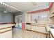 Kitchen featuring white cabinetry, tiled floors, and stainless-steel appliances at 7317 W Pocahontas Ave, Tampa, FL 33634