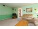The open living room features a comfortable seating area, and TV, perfect for relaxation at 7317 W Pocahontas Ave, Tampa, FL 33634