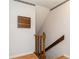 Wooden staircase with unique railing design, adding a touch of charm to the home's interior at 7317 W Pocahontas Ave, Tampa, FL 33634