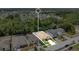 Aerial view highlights the home's location, landscaping, and proximity to nearby community amenities and scenic backdrop at 7518 Tangle Brook Blvd, Gibsonton, FL 33534