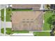 This aerial view shows the home's roof, landscaping, driveway, and proximity to neighboring houses at 7518 Tangle Brook Blvd, Gibsonton, FL 33534