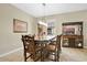 Inviting dining room featuring a wooden table set with seating for eight and beautiful natural light at 7518 Tangle Brook Blvd, Gibsonton, FL 33534