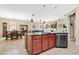 Open-concept kitchen with island seating and views of dining and living areas at 7518 Tangle Brook Blvd, Gibsonton, FL 33534