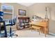 Charming living room featuring a piano, bookshelf, and comfortable desk area for versatile living at 7518 Tangle Brook Blvd, Gibsonton, FL 33534