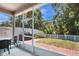 Enjoy outdoor living in this screened patio with views of the serene, fenced backyard at 7518 Tangle Brook Blvd, Gibsonton, FL 33534