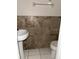 Half bathroom with tiled wall backsplash and sink at 7605 W Deleon Ct, Tampa, FL 33615