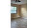 The bedroom offers a window and neutral walls at 7605 W Deleon Ct, Tampa, FL 33615