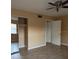 The bedroom has a ceiling fan and a mirrored closet at 7605 W Deleon Ct, Tampa, FL 33615