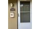 Close up of the townhome front door with address, light fixture, and mailbox at 7605 W Deleon Ct, Tampa, FL 33615