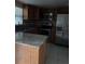 Updated kitchen with stainless steel appliances, granite counters, and tiled flooring at 7605 W Deleon Ct, Tampa, FL 33615