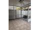 Enclosed patio area with tiled flooring and privacy fence at 7605 W Deleon Ct, Tampa, FL 33615