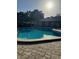 Community pool and building in the background at 7605 W Deleon Ct, Tampa, FL 33615