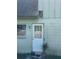 Close up of back door and a section of damaged exterior siding, highlighting the need for repairs at 8244 125Th St, Seminole, FL 33772