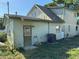 Rear of the house shows 'For Sale by Owner' sign on door, an AC unit, and side yard at 8244 125Th St, Seminole, FL 33772