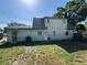 Back view of a two-story house with an ample backyard that offers a private outdoor space at 8244 125Th St, Seminole, FL 33772