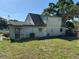 Back view of a two-story house with an ample backyard that offers a private outdoor space at 8244 125Th St, Seminole, FL 33772