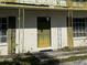 Traditional brick home featuring olive colored brick, front door, decorative shutters and wrought iron accents at 8244 125Th St, Seminole, FL 33772