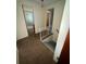 Hallway area featuring stairs to the basement and access to the bathroom at 8244 125Th St, Seminole, FL 33772