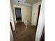 Hallway with stairs and doorways leading to various rooms at 8244 125Th St, Seminole, FL 33772