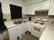 Features a stove and sink with white cabinets at 8244 125Th St, Seminole, FL 33772