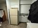 Features a refrigerator and white cabinets at 8244 125Th St, Seminole, FL 33772