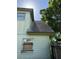 Shingle roof of home with a reflection of trees and sky in the windows, showing roof condition at 8244 125Th St, Seminole, FL 33772