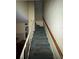 Carpeted staircase with white and wooden railings at 8244 125Th St, Seminole, FL 33772