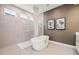 Stylish bathroom showcasing a freestanding tub and glass-enclosed shower with neutral tile at 8913 Bernini Pl, Sarasota, FL 34240