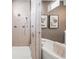 Modern shower features glass enclosure, tiled walls, and sleek fixtures at 8913 Bernini Pl, Sarasota, FL 34240