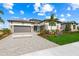 Beautiful single-Gathering home with a lush lawn, large driveway, and a two-car garage at 8913 Bernini Pl, Sarasota, FL 34240
