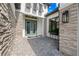 Stylish front entrance with double doors, stone accents, and a paved walkway leading to the door at 8913 Bernini Pl, Sarasota, FL 34240