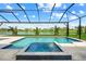 Inviting pool with a spa and tranquil water views at 8913 Bernini Pl, Sarasota, FL 34240