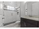 Modern bathroom features a walk-in shower with subway tile and a granite vanity at 1002 Cavour Ct, Brandon, FL 33511