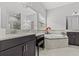 Relaxing primary bathroom features a soaking tub, double sinks, and ample counter space at 1002 Cavour Ct, Brandon, FL 33511