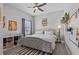 Comfortable bedroom featuring stylish decor, ceiling fan and a large window at 1002 Cavour Ct, Brandon, FL 33511
