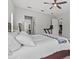 Light bedroom offering a ceiling fan and a glimpse into the ensuite bathroom at 1002 Cavour Ct, Brandon, FL 33511