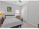 Comfortable bedroom with a chair, closet, ceiling fan, and inviting decor at 1002 Cavour Ct, Brandon, FL 33511