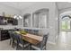 Elegant dining room featuring a built-in wine bar and direct access to the entry hall at 1002 Cavour Ct, Brandon, FL 33511