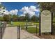Community dog park surrounded by chainlink fence and green grass at 1002 Cavour Ct, Brandon, FL 33511