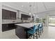 Spacious kitchen featuring a large center island with seating and stainless steel hood at 1002 Cavour Ct, Brandon, FL 33511