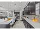 Expansive kitchen featuring a large center island with bar seating and dark wood cabinetry at 1002 Cavour Ct, Brandon, FL 33511