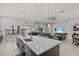 Bright open concept kitchen and living room area with lots of natural light and outdoor views at 1002 Cavour Ct, Brandon, FL 33511