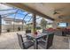 Covered patio with pavers, dining table, ceiling fans, and outdoor seating at 1002 Cavour Ct, Brandon, FL 33511