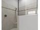 Walk-in shower features tiled walls, mosaic accents, and a glass enclosure at 1002 Cavour Ct, Brandon, FL 33511