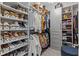 Spacious walk-in closet with custom shelving, clothing racks, and ample storage space at 1002 Cavour Ct, Brandon, FL 33511