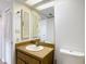Bathroom with traditional style vanity with large mirror and standard toilet at 1041 Bowsprit Ln # 1041, Holiday, FL 34691